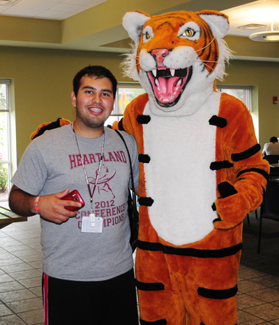 Jesus Berlanga, a native of Saltillo, Mexico, who recently moved to Lebanon, Ky., poses with Clawz, Campbellsville University's mascot at L.I.N.C. Orientation, July 13 and 14. (Campbellsville University Photo by Ellie McKinley)