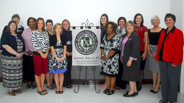 Students and faculty inducted in Kappa Delta Pi include from left: Front row—Marilyn Goodwin, instructor of early childhood education; Elizabeth Stewart of Campbellsville, Ky.; Ciara Phillips of Campbellsville, Ky.; Donna Vestal of Louisville, Ky.; Dr. Kathleen Filkins, associate professor of education; and Dr. Carolyn Garrison, professor of education. Back row—Dr. Brenda Priddy, dean of the School of Education; Dr. Priscilla Brame, assistant professor of education; Susan Blevins, assistant professor of education; Alena Maggard of Burnside, Ky.; Brittany Hahn, president of the university’s chapter; Leigh Anne Alexander; Caitlin Smith of Russell Springs, Ky.; and Norma Wheat, instructor of special education. (Campbellsville University Photo by Joan C. McKinney)