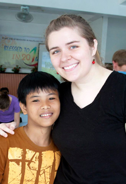 Katie Johnson, right, a May graduate from Leitchfield, Ky., made friends with Aldrin in the Philippines.