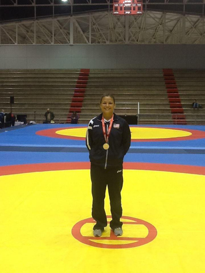 Kayla Miracle poses with her Pan Am Junior Wrestling  Championship gold medal in 2013 in Chile. (Photo courtesy of Kayla Miracle)