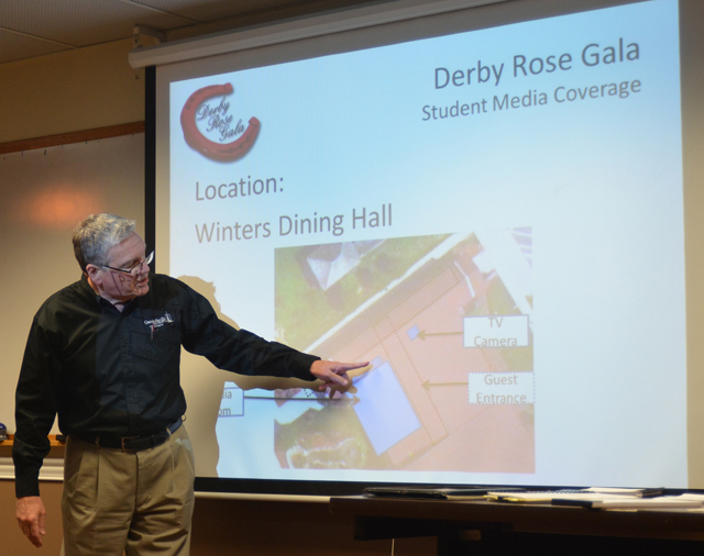 Dr. Keith Spears, vice president for regional and professional education, makes plans for the student media coverage of the Derby Rose Gala. (Campbellsville University Photo by Harry Haynes)