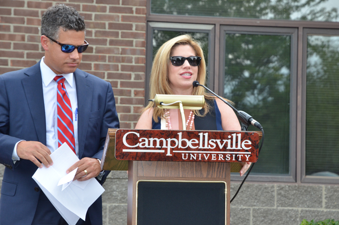 Stephanie Montgomery, right, talks about her experiences at and love for Campbellsville University and her mother during the dedication of the Ella Louise “Lou” Montgomery academic building at the Louisville Education Center. With her is her brother, Kris, who also spoke of her mother’s love for education and always encouraging them to be the best they could be. (Campbellsville University Photo by Joan C. McKinney)