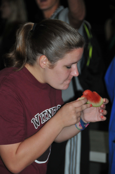 Kristin King of Tompkinsville, Ky., takes a bite at the annual watermelon feast, hosted by Campbellsville University’s  Baptist Campus Ministry. (Campbellsville University Photo by Christina L. Kern)
