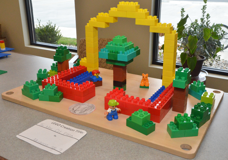 Students from Campbellsville and Taylor County schools were part of a local competition at Taylor County Public Library to create something out of LEGO bricks or MEGA Bloks. One student, Adrianna Celis, age 9, decided to recreate Campbellsville University's Alumni & Friends Park, Noe Plaza with MEGA Blocks, complete with benches, trees, a construction worker, CU sidewalk signage and the Taylor Fountain. (Campbellsville University Photo by Drew Tucker)