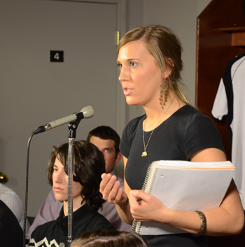 Lacy Mudd of Campbellsville, a student in copyediting at Campbellsville University, asks a question about what constitutes child abuse at the press conference. (Camp- bellsville University Photo by Joan C. McKinney)