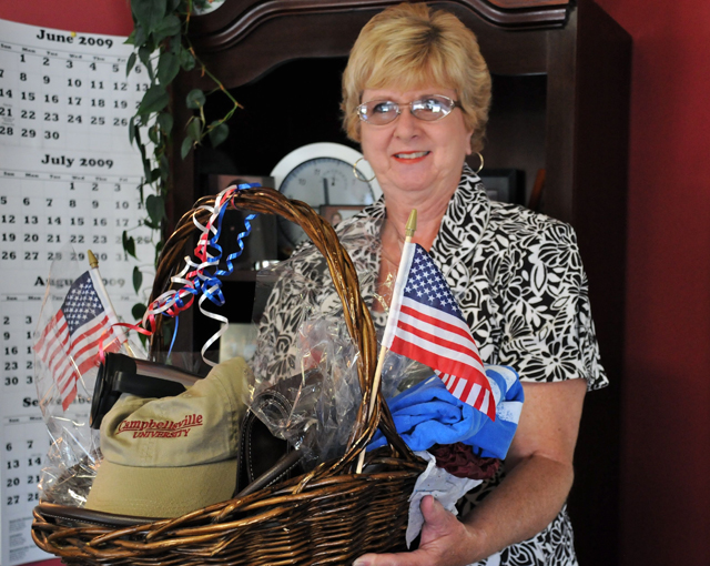 The winner of Campbellsville University's July 4th prize gift basket was Linda Beal from Casey Creek, Ky. She is a graduate of Taylor county High School and a 1966 alumna of CU. Beal said she was very excited to have won and it had come as a complete surprise. "I just stopped by the booth for directions," she said, "and Emma Revis told me to put my name in the box!" (CU photo by Linda Waggener)