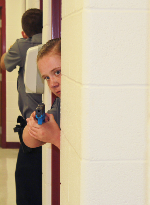 Makinsey Rogers from Louisville Metro Police Department Explorers is in shooting stance during a real- life shoot out Scenario. (Campbellsville University Photo by Joshua Williams)