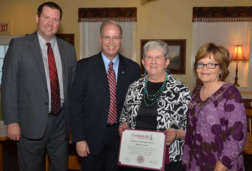 Malinda Smith, second from left, receives the Servant Leadership Award at the “Campaign for the Commonwealth” event in Stanford, Ky. From left are: Benji Kelly, vice president for development; Smith; Paula Smith, director of alumni relations; and Dr. Michael V. Carter, president. (Campbellsville University Photo by Joan C. McKinney)