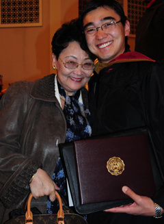 Bayarmagnai "Max"Nergui, right,  receives a hug from his mother,  Davaatseren Khaisandai, who came  from Mongolia to see him receive his master of business administration degree. (Campbellsville University  Photo by Christina Miller)