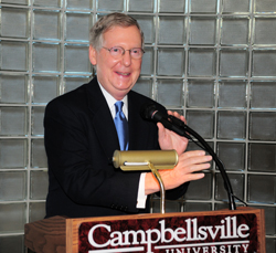 Above, Barry Bertram, a member of the CU Board of Trustees, talks with U.S. Sen. Mitch McConnell after the reception in McConnell's honor. Campbellsville Mayor Brenda Allen, in picture above at left, gets U.S. Sen. Mitch McConnell's autograph. McConnell addressed a crowd in the Winters Dining Hall. Kyle Davis, director of campus safety, was one of those having their picture made with McConnell. (Campbellsville University Photos by Joan C. McKinney)