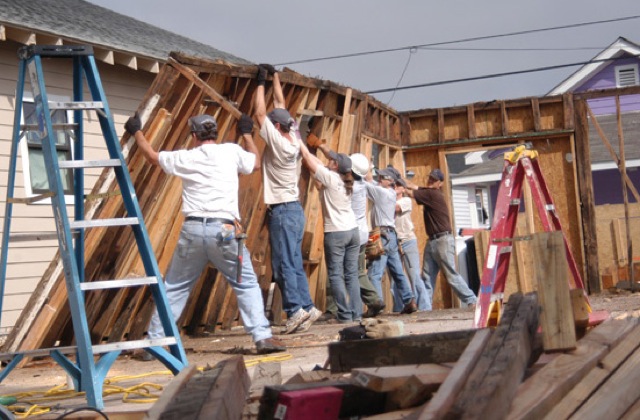 A group of Campbellsville University students helps tear down the wall of a home destroyed by Hurricane Katrina during a Spring Break mission trip to New Orleans. (Campbellsville University Photo by Rachel Crenshaw)