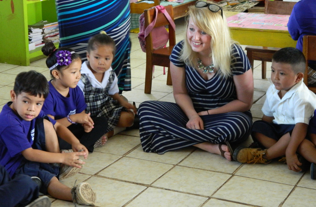 Nakita Gavre, a student from Harned, Ky., interacts with pre-school students in a classroom in  Belize during spring break in March 2015.