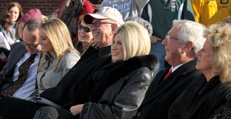 Dr. Larry and Beverly Noe laugh during the dedication of the  Alumni & Friends Park and Noe Plaza, named after his parents  James L. Noe Sr. and Louise B. Noe. At left are their daughter  Ashley with her husband Dr. David Meister. Taylor County  Judge/Executive Eddie Rogers and his wife Theresia are at right.  (CU Photo by Linda Waggener)