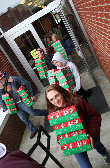 Amanda Lindsey, a freshman from Leitchfield, Ky., leads a group of  students carrying Operation Christmas Child shoeboxes. CU helped  the community collect 7,647 boxes -- 1,626 more than last year.  (Campbellsville University Photo by Rachel DeCoursey)