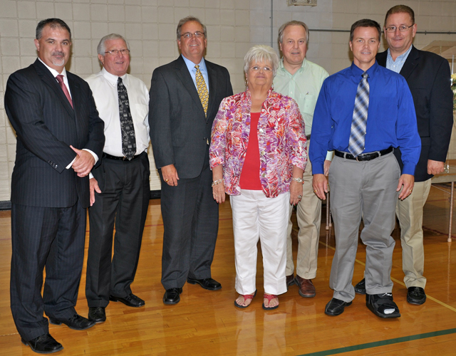 Campbellsville/Taylor County Chamber of Commerce officials, director Judy Cox, and president Chris Kidwell, in front, are shown with political leaders from left in back: State Rep. John Bam Carney; Taylor County Judge Executive Eddie Rogers; Campbellsville Mayor Tony Young; luncheon speaker Congressman Ed Whitfield; and Senator Jimmy Higdon. (Campbellsville University Photo by Linda Waggener) 