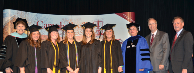 Campbellsville University’s P-5, elementary education graduates are pinned by Dr. Carol Garrison, third from right. From left are: Dr. Brenda Priddy with Kim Baker, Autumn Graham, Casey Mattingly, Rebekah Murphy and Kendra Nutter with Dr. Michael V. Carter and Dr. Frank Cheatham. (Campbellsville University Photo by Joan C. McKinney)