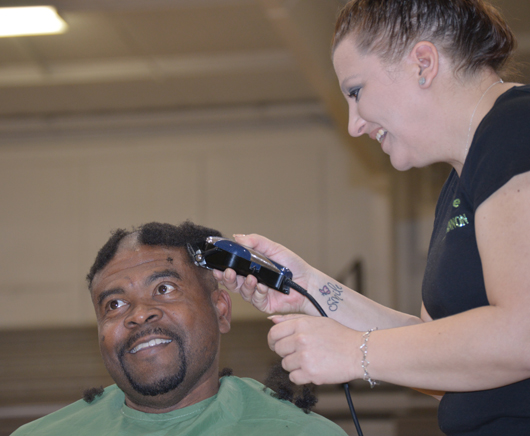 Perry Thomas, head football coach at Campbellsville University, had his head shaved at St. Baldrick's March 21. (Campbellsville University Photo by  Mikayla Smith)