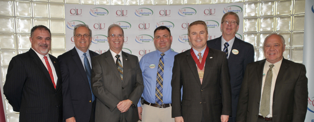 Speakers at Campbellsville University's Kentucky Proud Farm to Campus announcement were with Pioneer College Caterers Inc. representatives. From left are Bam Carney; Tony Young; Dr. Michael V. Carter; Heith Hall, CU food services director for Pioneer; James Comer; Tim Wolters, vice president for operations for Pioneer College Caterers Inc.; and Dan Poset, district manager for Pioneer College Caterers Inc. (Campbellsville University Photo by Linda Waggener)