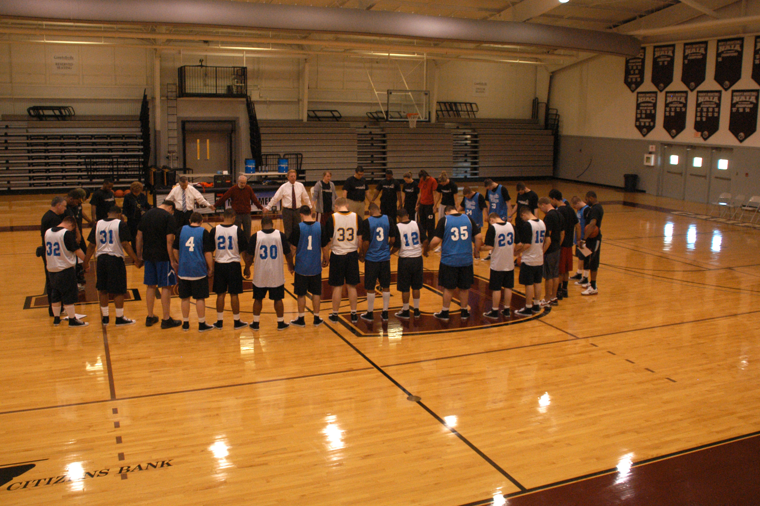 The group prays before beginning the one-day basketball clinic, which was an event at Campbellsville University held for those boys who have had “good behavior” from Lincoln Village, a boys’ detention center in Hardin County. (Campbellsville University Photo by Chris Megginson)