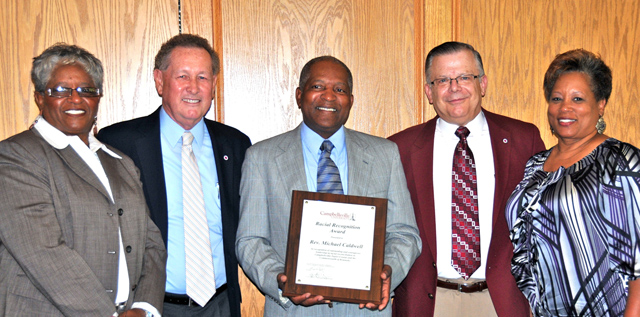 The Campbellsville University Racial Reconciliation Award was recently presented to local leader  the Rev. Michael Caldwell, center, pastor of Pleasant Union Baptist Church. From left are: Yevette  Haskins, co-chair of Greater Campbellsville United; Dr. Frank Cheatham, CU vice president for  academic affairs; Caldwell; John Chowning, CU vice president for church and external relations and  executive assistant to the president; and Wanda Washington, coordinator of GCU. (Campbellsville  University Photo by Linda Waggener)