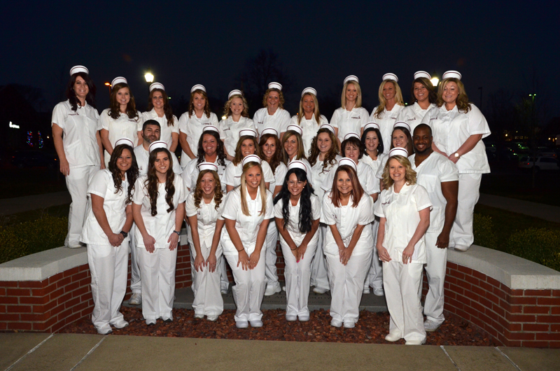  Campbellsville University School of Nursing students who were pinning in a ceremony Dec. 11 include from left: Front row -- Sarah Tanaka of Campbellsville, Ky.; Rachel Smith of Louisville, Ky.; Sarah Apedaile of Hendersonville, Tenn.; Jacklyn Wahl of Liberty, Ky.; Cheyenne Gettings of Greensburg, Ky.; Jeannie Lyons of Liberty, Ky.; and Carla Mattingly of Lebanon, Ky. Second row – Alex Montgomery of Campbellsville, Ky.; Tonya Kessler of Campbellsville, Ky.; Erin Clarkson of Bonita Springs, Fla.; Emilee York of Liberty, Ky.; Lara Bland of Campbellsville, Ky.; Jessica Cross of Russell Springs, Ky.; Melinda Osborne of Elkhorn, Ky.; Katie Watson of Campbellsville, Ky.; Jesslyn Kelsey of Stanford, Ky. and Thomas Singleton of Campbellsville, Ky. Back row – Renee Bell of Campbellsville, Ky.; Bethany Gusler of Sonora, Ky.; Hillary Hutchison of Columbia, Ky.; Kisha Miller of Russell Springs, Ky.; Mackenzie Gentry of Greensburg, Ky.; Barbara McGuffin of Albany, Ky.; Deborah Sullivan of Campbellsville, Ky.; Madison Walls of Lebanon, Ky.; Emily Taylor of Liberty, Ky.; Brittany Grant of Glasgow, Ky., and Patricia Tupman of Columbia, Ky. (Campbellsville University Photo by Joan C. McKinney)