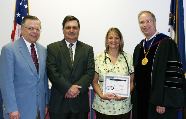 Campbellsville University and LCCAA leaders are shown with new SRNA program graduate, Susan Rainer from Jamestown. From left are: John Chowning, CU vice president for church and external relations and executive assistant to the president; Bruce B. Brown, Executive Director at LCCAA; Susan Rainer, JOBS Program graduate and new SRNA; and CU President Dr. Michael V. Carter. (Photo courtesy of LCCAA)