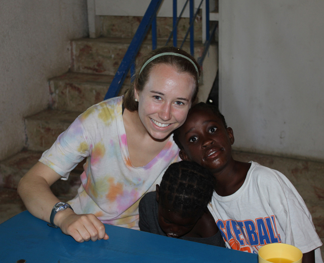 Savannah Workman hugs some children in Neply, Haiti during her mission trip.