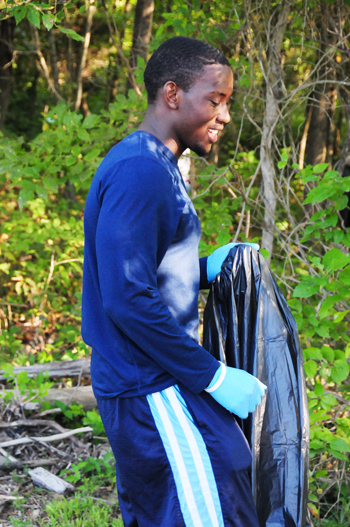Seron Martin, a sophomore wrestler from Louisville, helped pick up trash. (Campbellsville University Photo by Kasey Ricketts)