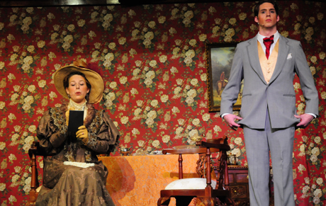 Singrid Tipton, left, of Lawrenceburg, Ky., questions Dakota Rogers of Harrodsburg, Ky., as to his qualities as a suitor in the play. Tipton plays Lady Bracknell, and Rogers is Jack in the play. (Campbellsville University Photo by Ashley Wilson)
