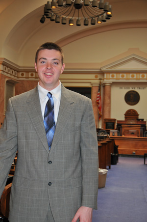 Micah Spicer stands in the House of  Representatives. His dream job is to  represent his hometown in Graves County.  (Campbellsville University Photo by Christina Miller)