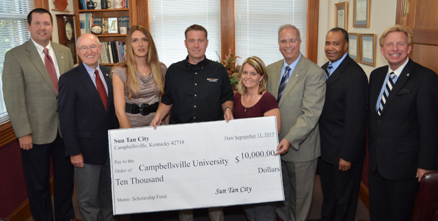 Sun Tan City has pledged $10,000 to continue their corporate sponsorship and to make an additional contribution to the Campbellsville University Scholarship Fund in each of the next four years. From left are: Benji Kelly, vice president for development, and Chuck Vaughn, director of planned giving, both from CU; Amy Smith, regional manager; Mark Nelson, vice president of operations, a 2011 MBA CU graduate; Erin Kenady, district manager; Dr. Michael V. Carter, CU president; Dr. Joseph Owens, chair of the CU Board of Trustees; and Dr. Ted Taylor, director of CU’s Big Maroon Club. Sun Tan City has been a corporate sponsor for the last four years. (Campbellsville University Photo by Yvonne Matheas)