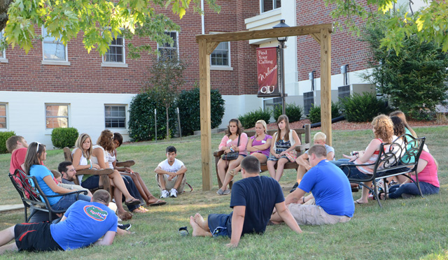 Dr. Thomas Jeffrey, instructional technologist and assistant professor, and his class sit outside talking about getting started in their first year at CU. (Campbellsville University Photo by Christina Kern)