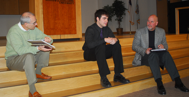 Trask Murphy of Madisonville, Ky., and professors, Dr. John Hurtgen, far left, and Dr. Scott Wigginton, right, discuss his sermon after delivery. (Campbellsville University Photo by Joan C. McKinney)