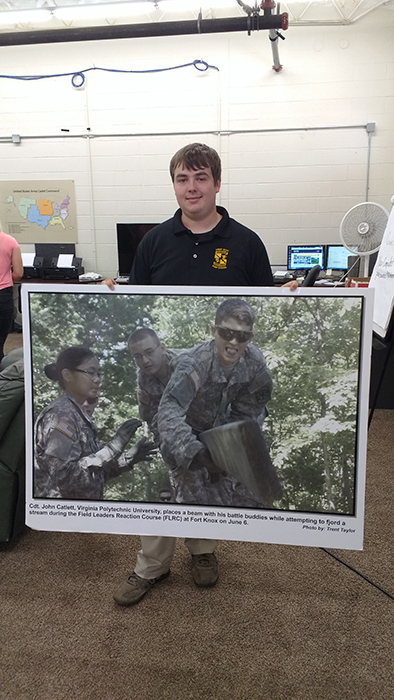 Trent Taylor, a photojournalism minor in Campbellsville University’s mass communication program poses with his award-winning photograph, selected as the photo of the week by Fort Knox leaders. Taylor joined four other CU students in an internship working for the U.S. Army Cadet Command documenting Army cadet training in order to promote, build and maintain the America’s public’s confidence in American’s Army leaders of tomorrow. (Campbellsville University Photo by Lt. Col. William Ritter)
