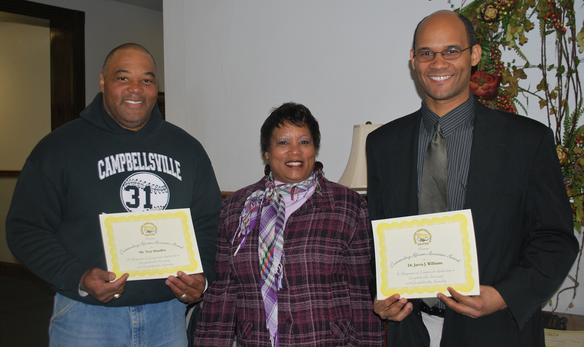 Campbellsville University employees, Troy Handley, left, and Dr. Jarvis Williams were honored by Greater Campbellsville United director Wanda Washington in honor of Black History Month. They were recognized as local outstanding African-Americans by Greater Campbellsville United. Handley has worked at Campbellsville University since 1997 and is a groundskeeper. Williams is assistant professor of New Testament and Greek and has been teaching at CU since January 2008. (Campbellsville University Photo by Munkh-Amgalan Galsanjamts)