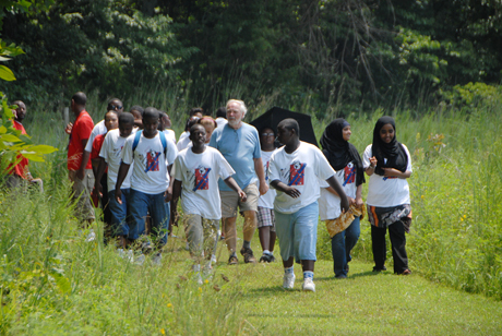 Dr. Gordon Weddle, director of Clay Hill Memorial Forest, leads the group from the Louisville Urban League at Campbellsville  University's Clay Hill Memorial Forest. (Campbellsville University Photo by Corey Young)