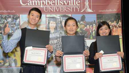 Mi Yingxin, left, Liu Ximan and Iku Kamata, right, pose with their  certificates as they graduate from the English as a Second Language  program at Campbellsville University. 