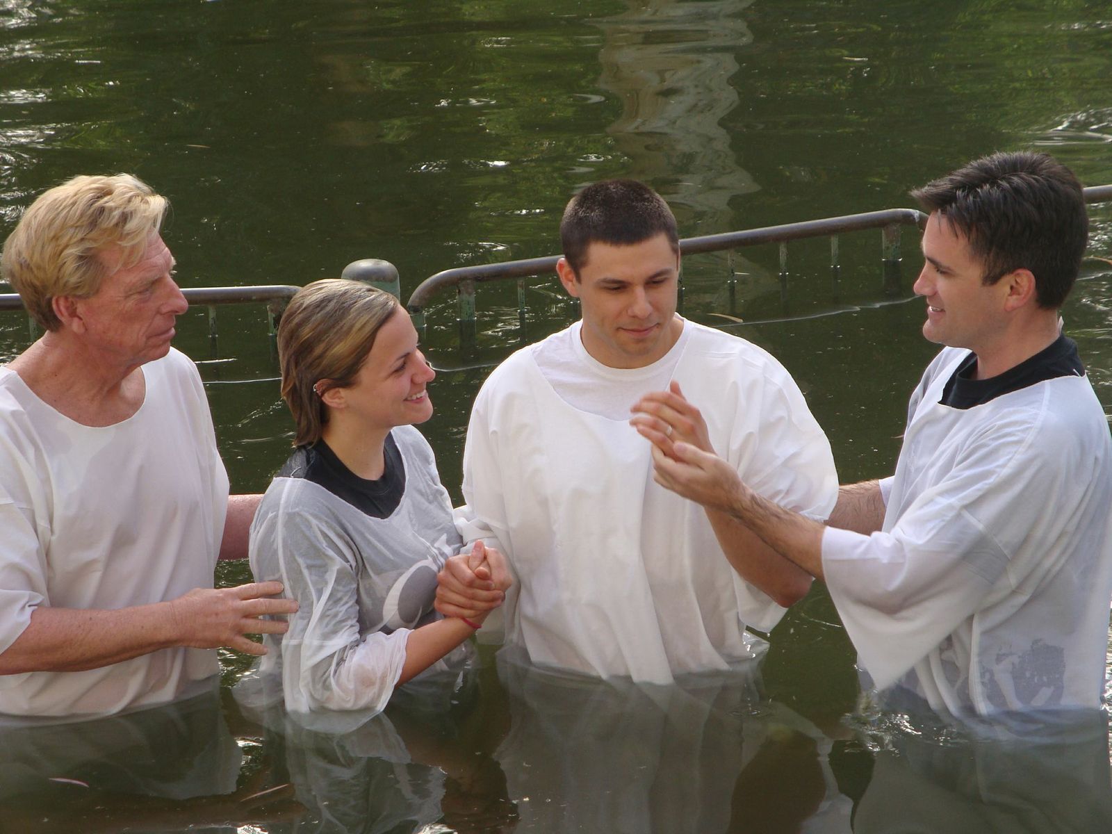 During the trip, many were baptized in the  River Jordan by Campbellsville University  faculty and staff members, Dr. Ted Taylor,  Dr. Shane Garrison, Dr. Scott Wigginton  and David Wray. From left: Taylor, Shelby  Hicks, Dalton Hicks and Garrison.