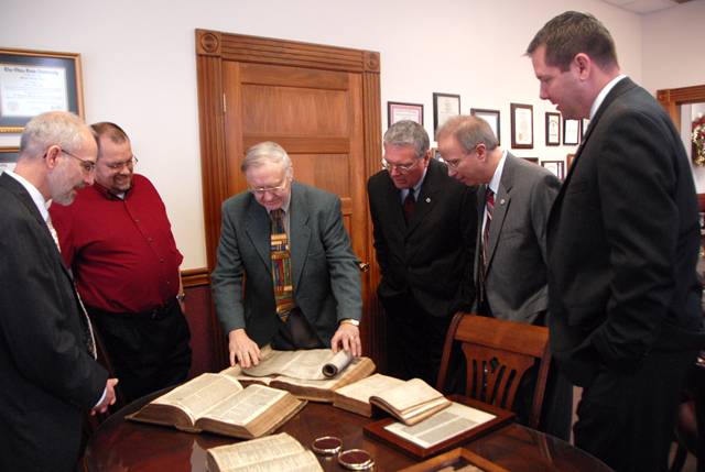 Dr. Joel F. Drinkard Jr., center, shows his collection of old Bibles to Dr. John Hurtgen, left, Dr. Dwayne Howell, Dr. Keith Spears, Dr. Michael V. Carter and Benji Kelly. (Campbellsville University Photo by Emily Campbell)