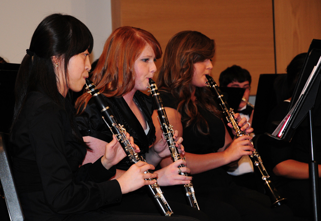 CU Concert Band members, from left, Gwanhee Park of Busan, Korea; Chasity Ballard of Bardstown, Ky.; and Jenna Embry of Leitchfield, Ky. play clarinet in a concert. (Campbellsville University Photo by Emily Campbell