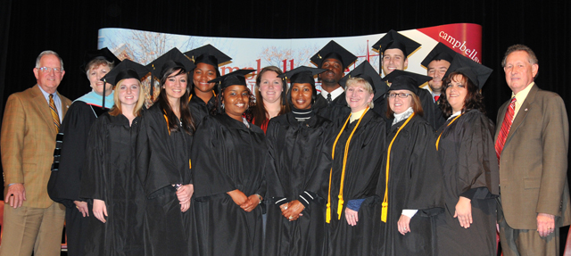Campbellsville University School of Education students participating in the pinning ceremony include from left: Front row – Lauren Thornsberry, Brittany Asbury, LaKesha Frye, Tonya Lewis, Bonnie Webster, Felechia Wainscott and Melissa Taylor with Dr. Frank Cheatham, vice president for academic affairs. Second row – Dr. Jay Conner, chair of the CU Board of Trustees; Dr. Brenda Priddy, dean of the School of Education; Whitney Vaughn, Morgan Bullock, Geoffrey James, Drew Simpson and Evan Pierce. (Campbellsville University Photo by Joan C. McKinney)