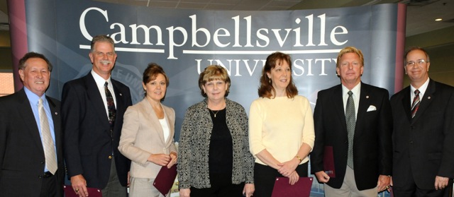 Awards for 15 years of service at Campbellsville University were given to from left: Dr. Frank Cheatham, presenter; Ed Pavy, Dottie Davis, Patty McDowell, Jill Roberts and Dr. Ted Taylor with Dr. Michael V. Carter, president, who made the presentations. (Campbellsville University Photo by Ashley Zsedenyi)