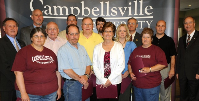 Campbellsville University employees honored for five years of service include from left: Front row - Brenda Porter, Alvin Humphress, Karen Fawcett and Lori England. Second row - Dr. Frank Cheatham, vice president for academic affairs, awards presenter; Dr. John Vokurka, Dr. Billy Stout, Dr. Donna Irwin,  Franky James and Dr. Michael V. Carter, president, who presented the awards. Back row - Dr. Scott Wigginton, Kenny Lawson, Chris Gibbs (substituting for his wife, Anne Gibbs) and Dr. Peter Adcock. (Campbellsville University Photo by Ashley Zsedenyi)