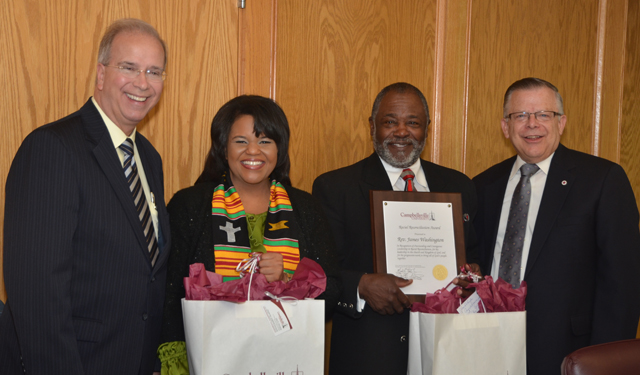 Campbellsville University president Michael V. Carter, left, presents gifts to Renee Shaw and the Rev. James Washington, recipient of the Racial Reconciliation Award, presented by the Rev. John Chowning, vice president for church and external relations and executive assistant to the president. (Campbellsville University Photo by Joan C. McKinney)