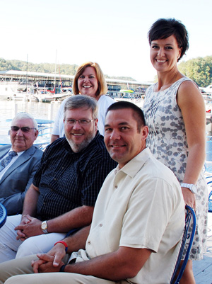 Attending the Jamestown Marina Labor Day  service were from left, seated: Fairview Baptist  Church Elder Rabon Smith, Pastor Jeff Eaton and Pastor Rick Mann. In the back are the pastors'  wives: Julie Winn Eaton, left, and Susan Branscum  Mann. (Campbellsville UniversityPhoto by Linda Waggener)