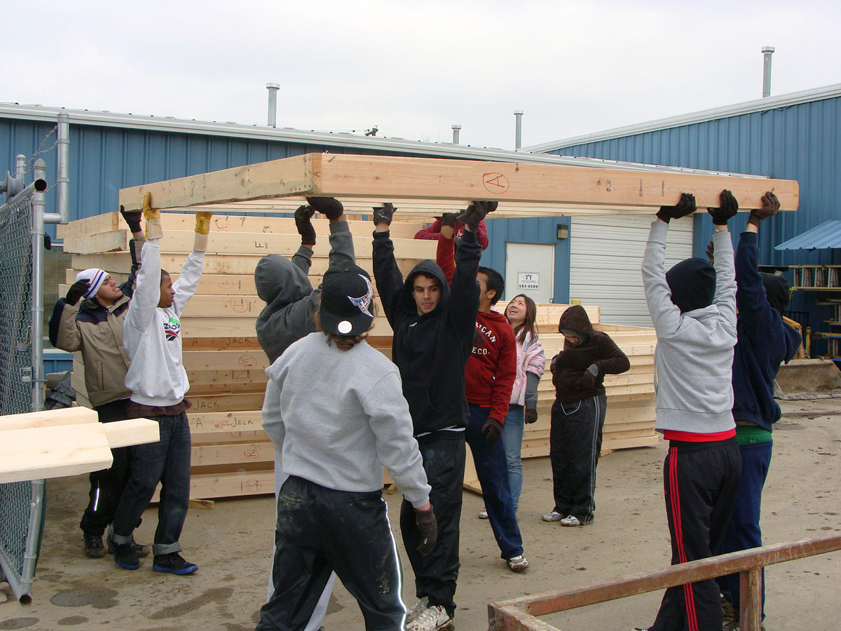 Campbellsville University international students move walls for Habitat for Humanity Metro Louisville during their community service project for "Give a Day, Get a Disney Day." (Campbellsville University photo by Laura Cromer)
