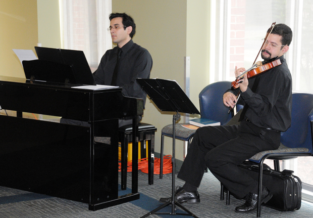 Dennis Santos, left, on piano, and Marcus Silva on violin performed during lunch at the Excellence in Teaching Awards Ceremony. (Campbellsville University Photo by Ashley Zsedenyi)