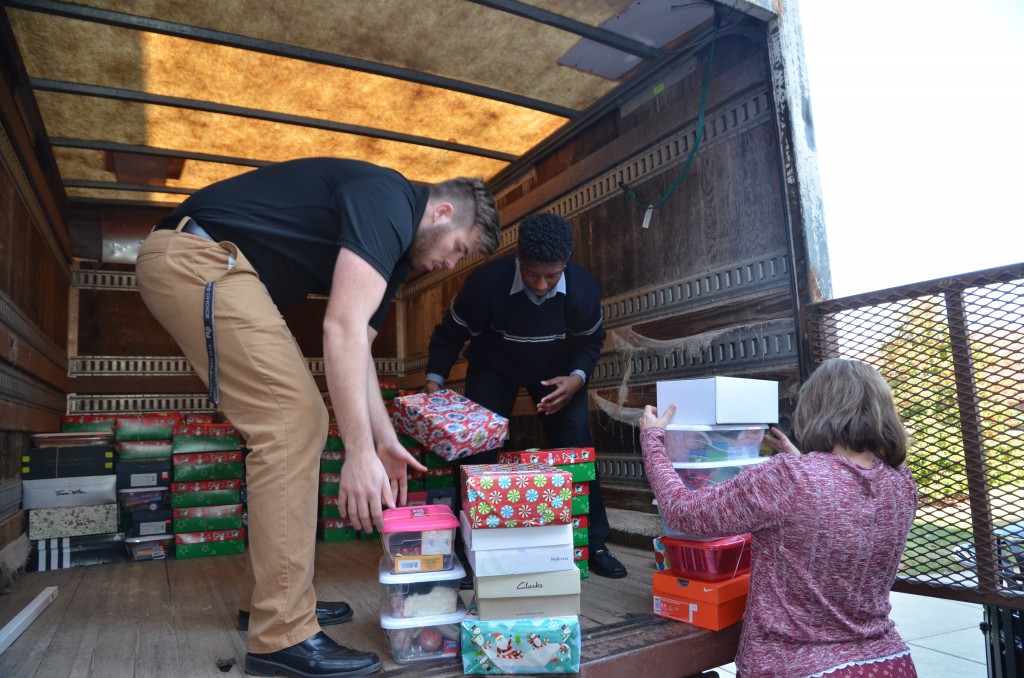 From left Aron Neal, Fontez Hill and Teresa Elmore help loading the truck with 790 Operation Christmas Child Boxes. (Campbellsville University Photo by Joan C. McKinney)