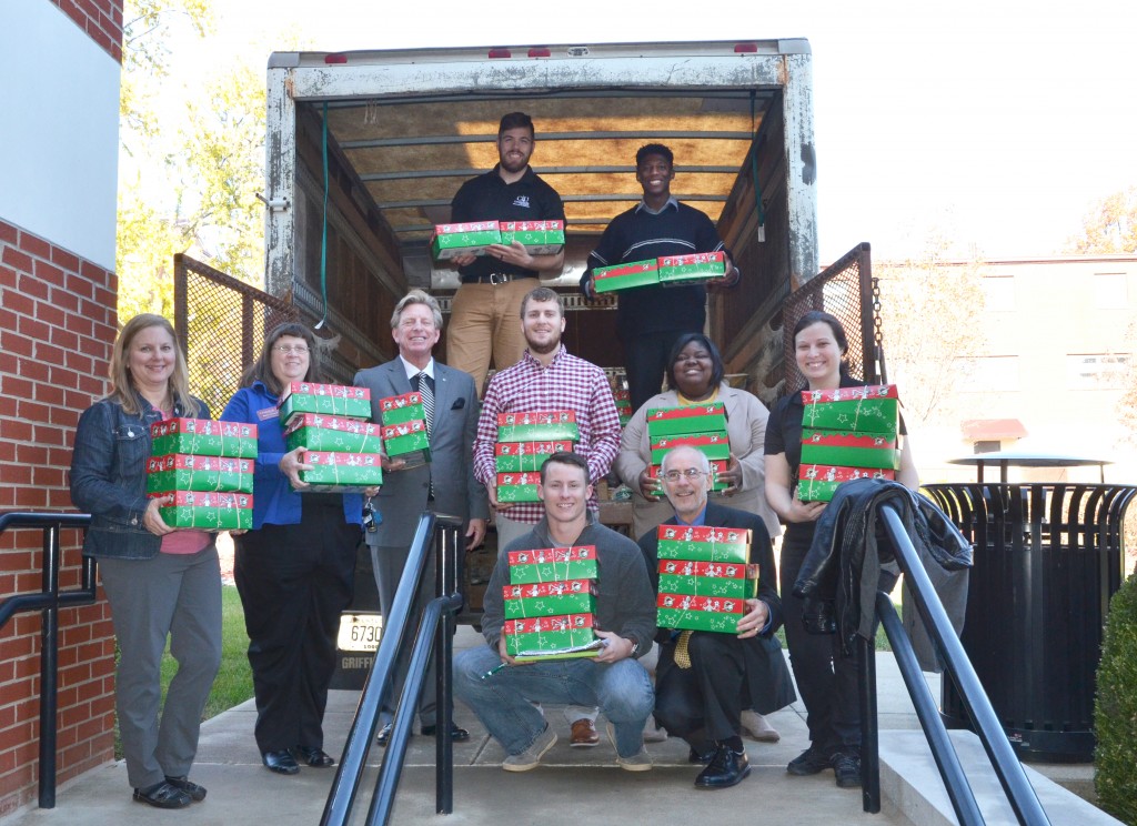 Finishing loading Operation Christmas Child boxes from Ransdell Chapel at Campbellsville University were from left: Front row – Austin Greer and Dr. John Hurtgen. Second row – Sherry Bowen, Dr. Marilyn Goodwin, Dr. G. Ted Taylor, Joey Bomia, Jasmine Barnett and Heather Sabo Graham. Third row – Aron Neal and Fontez Hill. The university collected 790 boxes. (Campbellsville University Photo by Joan C. McKinney)