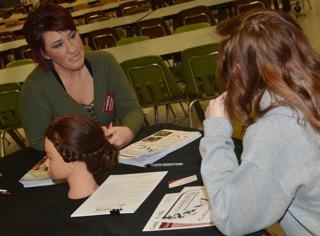 Samantha Hayes, an environment specialist at Campbellsville University, talks to CHS junior Jasmine Coomer about a career in cosmetology.